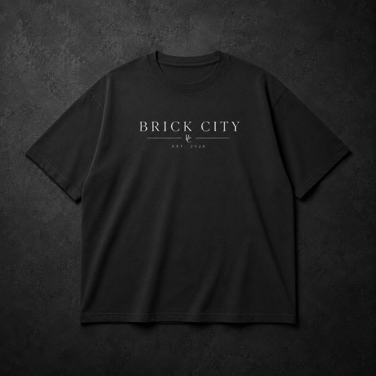 Black t-shirt with 'BRICK CITY' text on a dark textured background