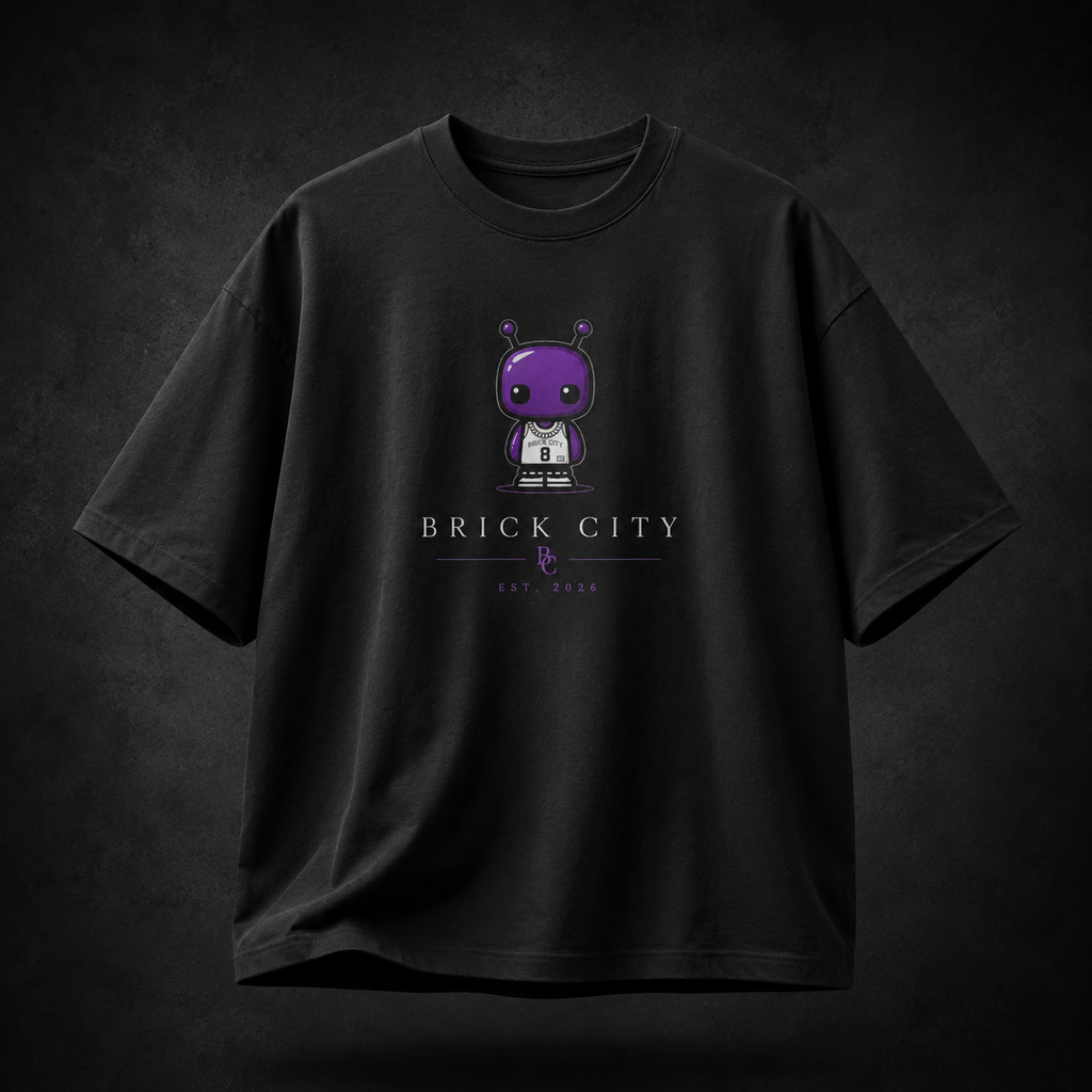 Black t-shirt with a cartoon character and 'Brick City' text on a dark background