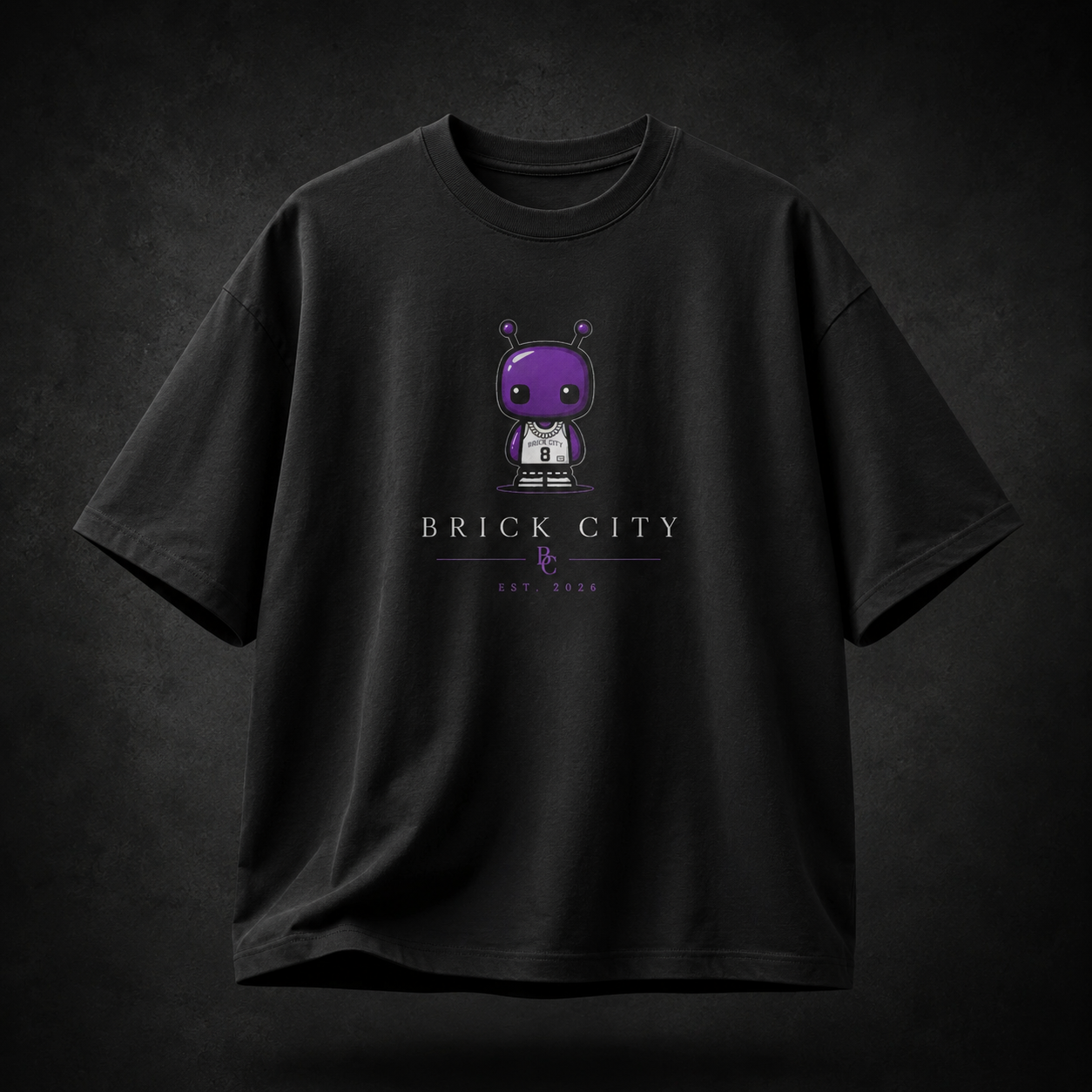 Black t-shirt with a cartoon character and 'Brick City' text on a dark background