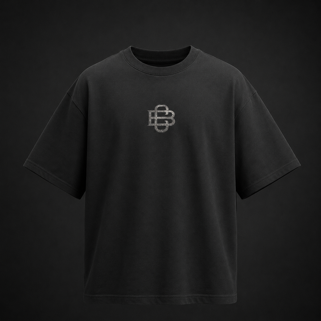 Black t-shirt with a logo on a dark background
