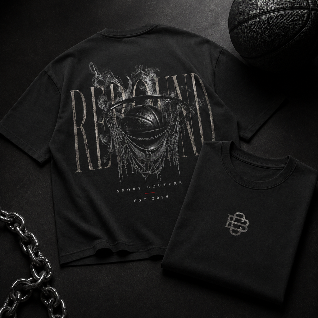 Black t-shirt with graphic design and text, folded black shirt, and basketball on a dark background