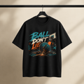 Ball Don’t Lie T-Shirt by Brick City on a studio product mockup