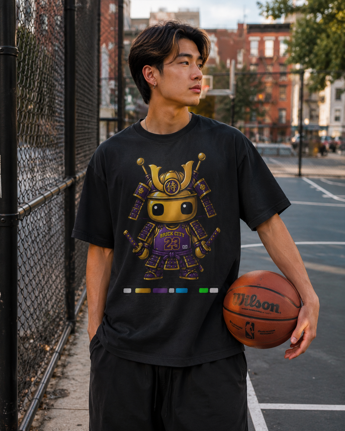 Black Yellow Brick 23 Tee with a gold and purple robot graphic on a dark background