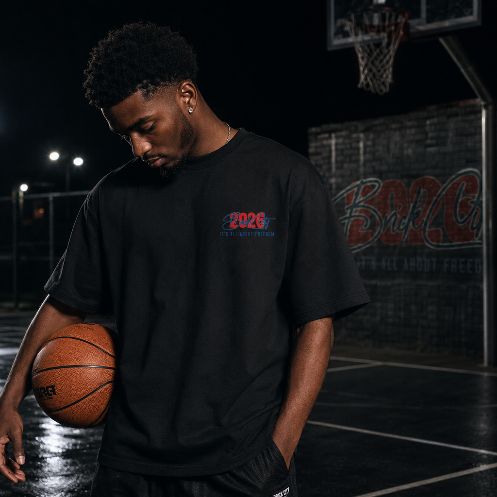 Man holding a basketball on a court with a dark background