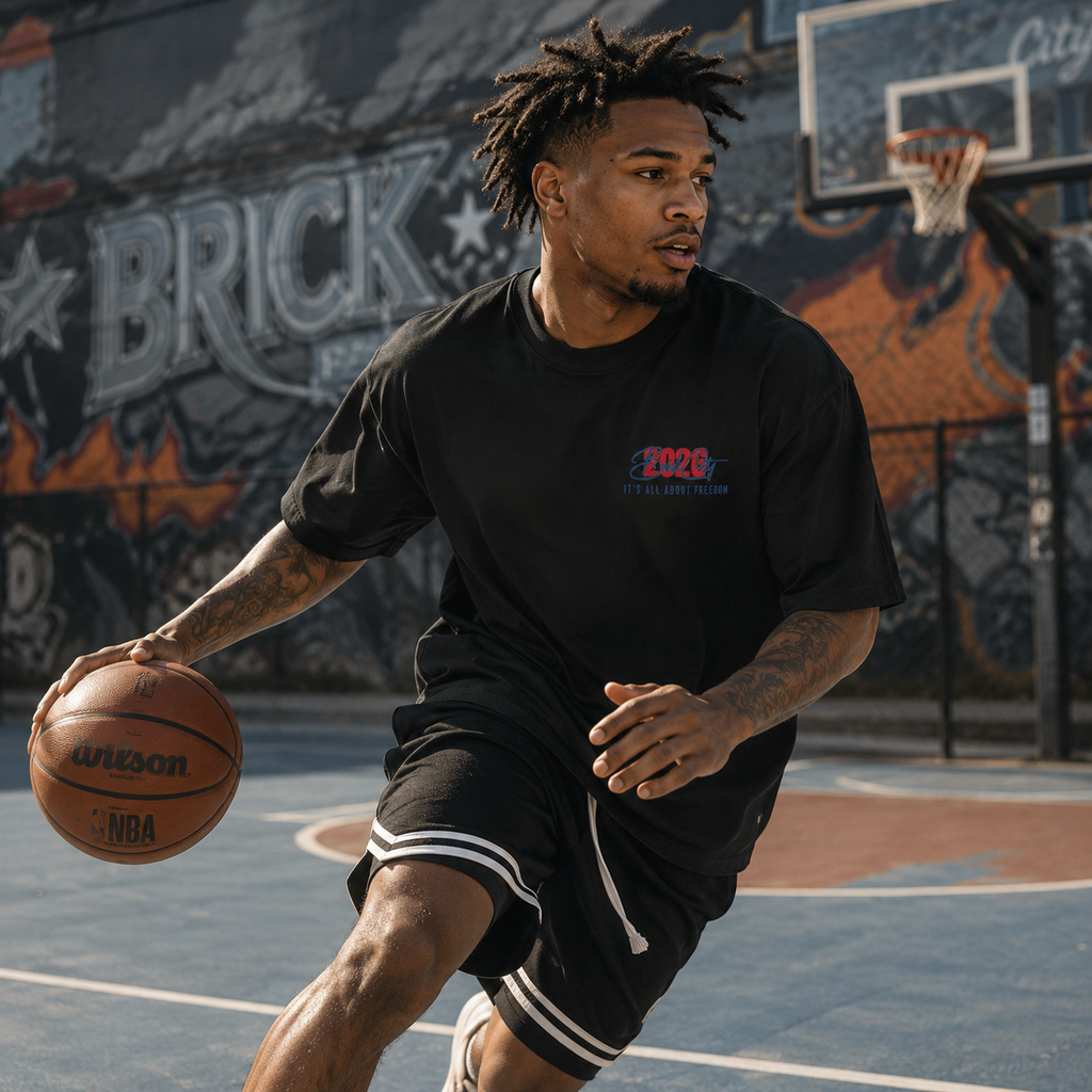 Man holding a basketball on an outdoor court with graffiti in the background