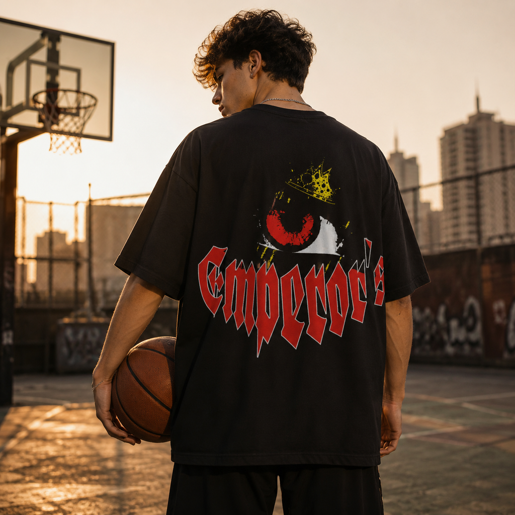 Person holding a basketball on an outdoor court with city skyline in the background