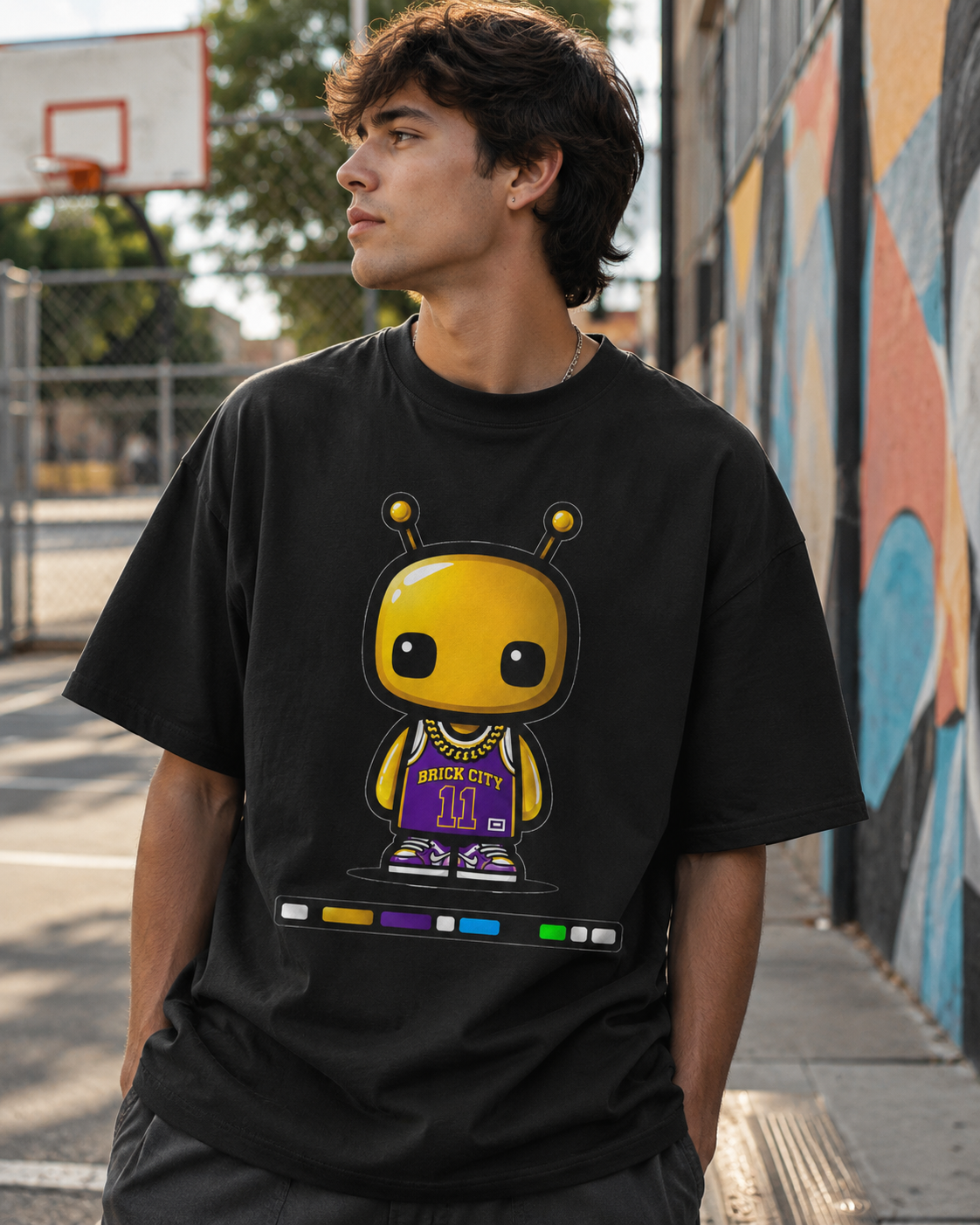 Person wearing a black t-shirt with a graphic design of a character in a basketball jersey.