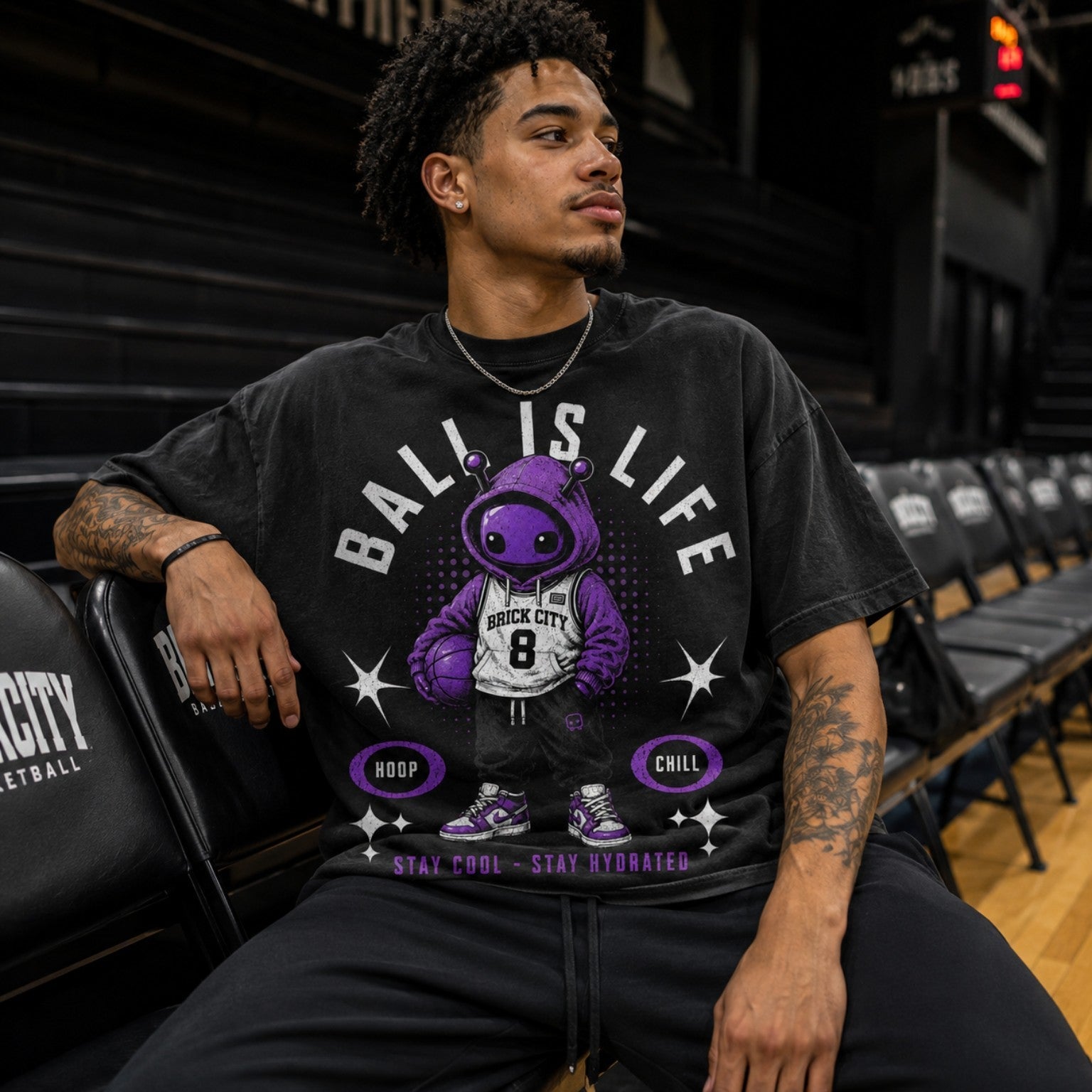 Ball Is Life Brick Tee worn courtside in basketball bench lifestyle photo