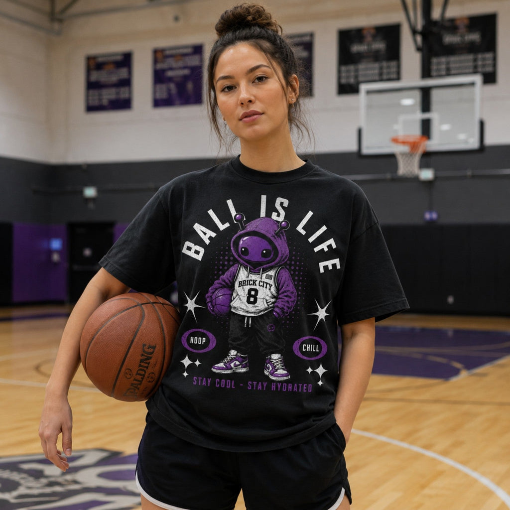 Model wearing Ball Is Life Brick Tee in indoor basketball court lifestyle photo