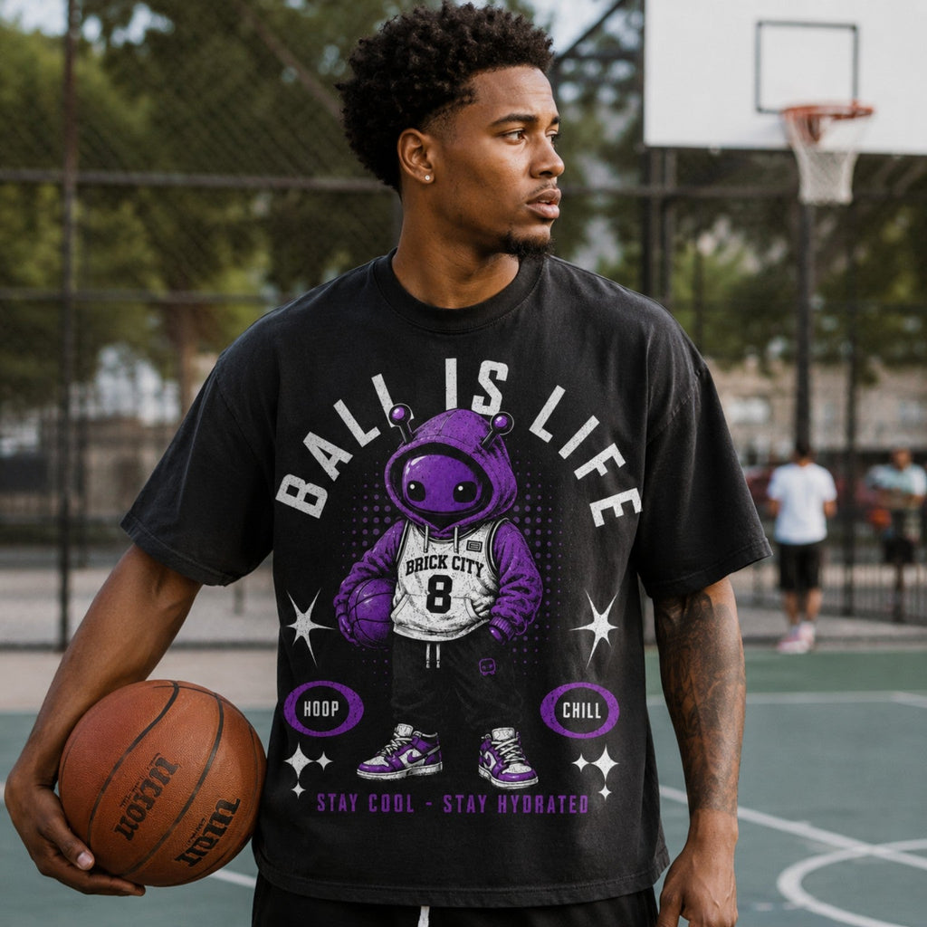 Model wearing Ball Is Life Brick Tee on outdoor basketball court portrait photo