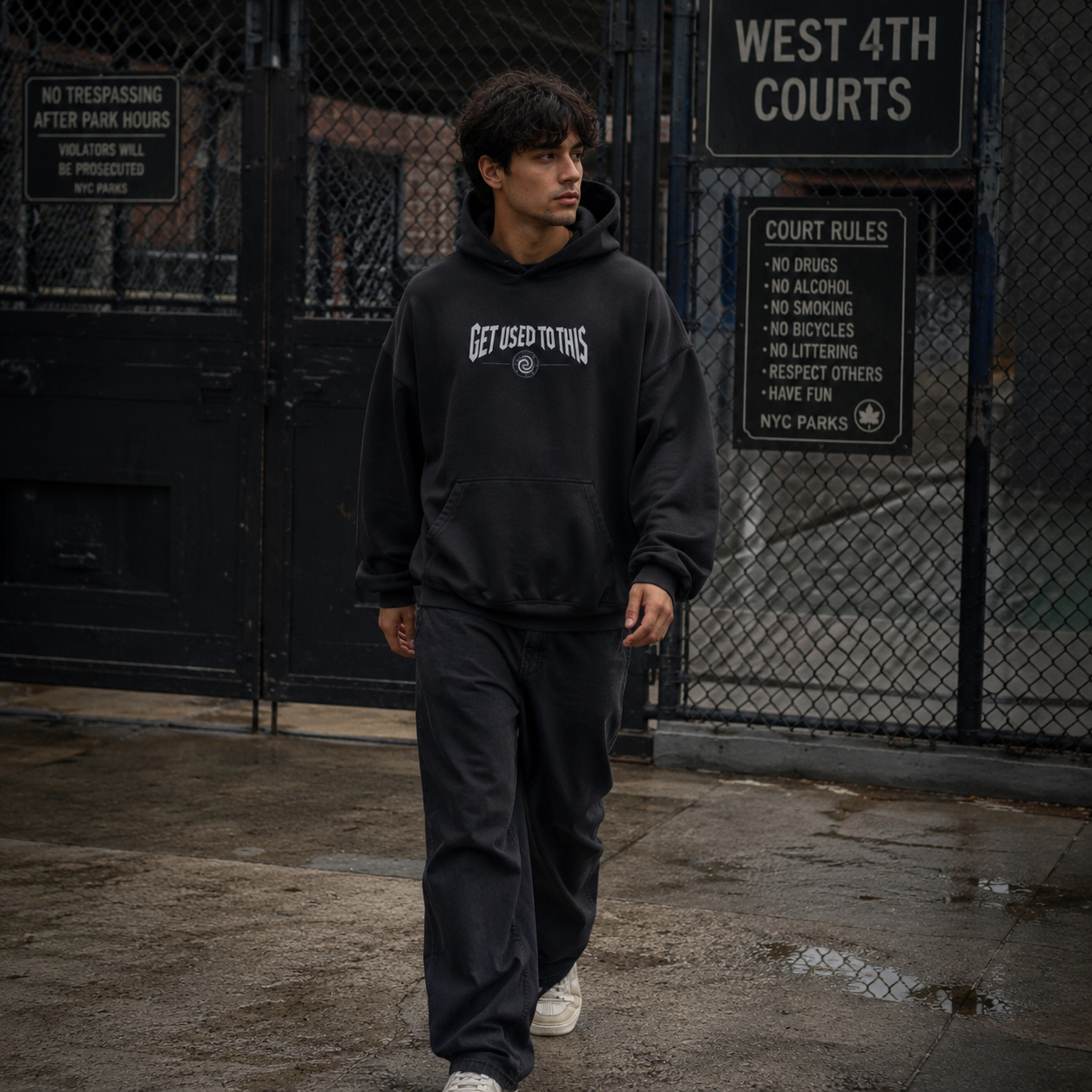 Man wearing Get Used To This basketball hoodie at West 4th Street courts in NYC