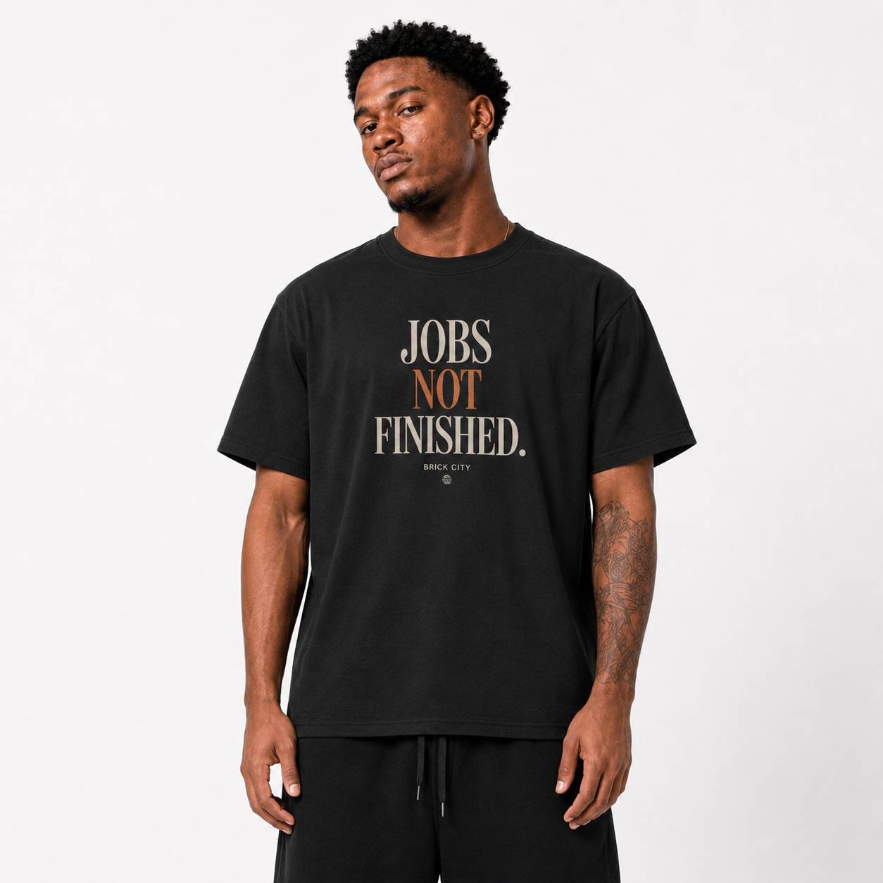 Jobs Not Finished T-Shirt on Brick City model in studio view four