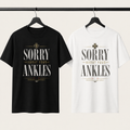 Sorry About Your Ankles T-Shirt in black and white on a studio clothing rail