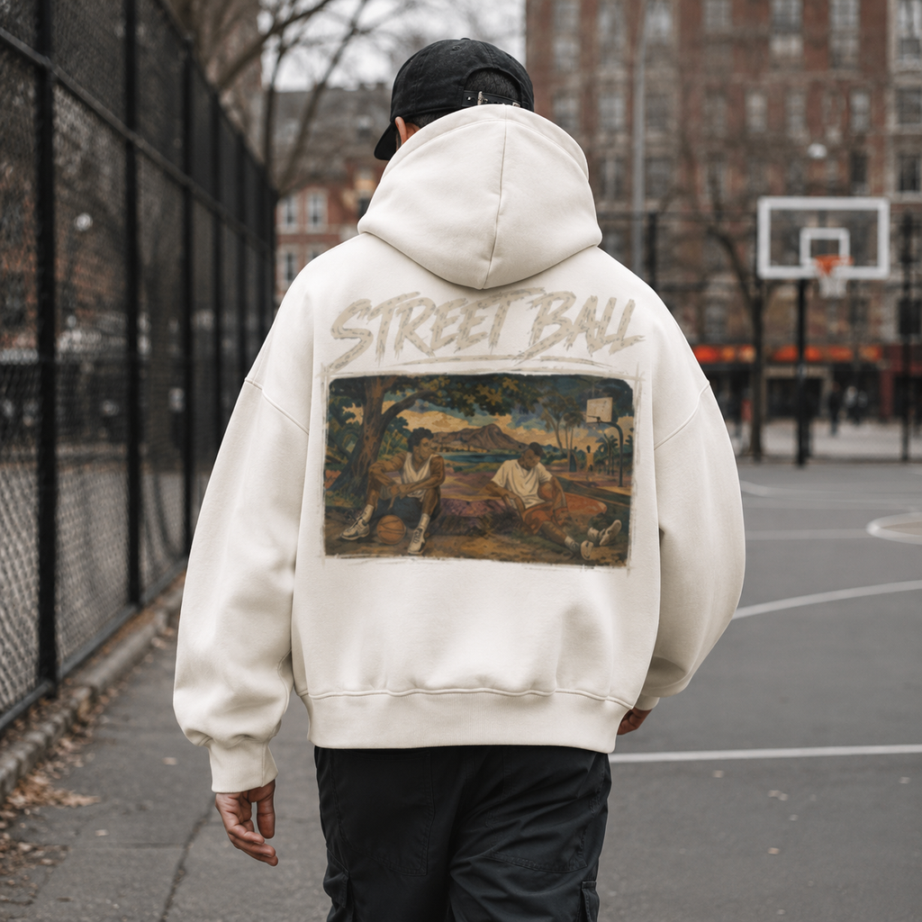 Man wearing light beige Streetball hoodie back art print on an outdoor court