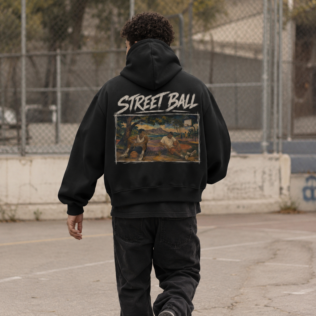 Man wearing black Streetball hoodie back art print on an outdoor court