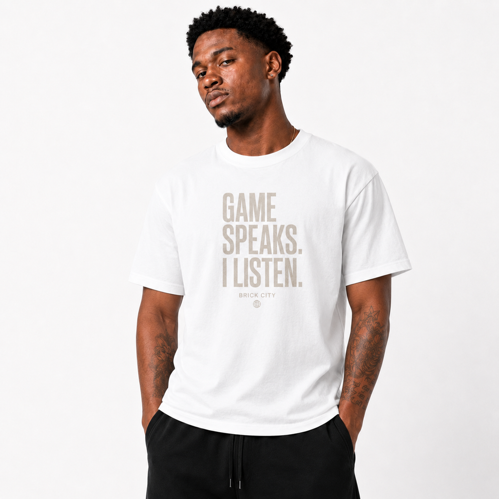 The Game Speaks, I Listen T-Shirt on Brick City model in studio view three