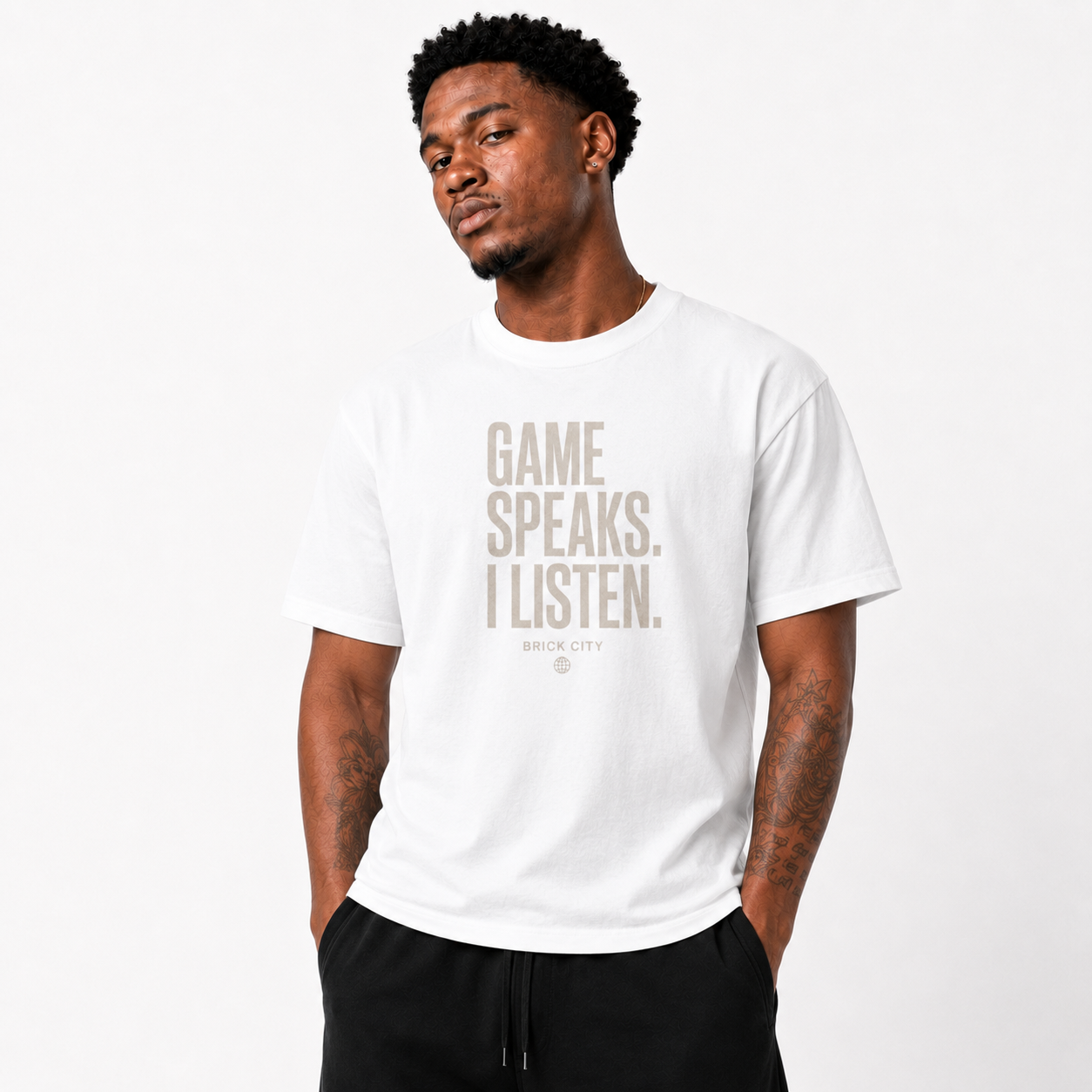 The Game Speaks, I Listen T-Shirt on Brick City model in studio view three