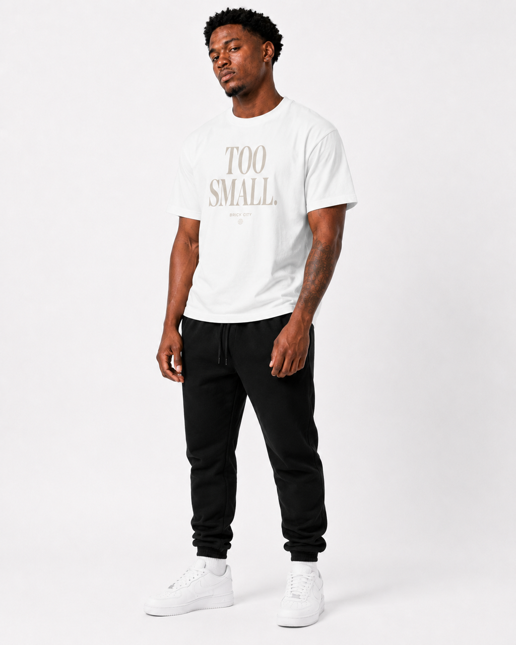 Too Small T-Shirt on Brick City model in studio view one