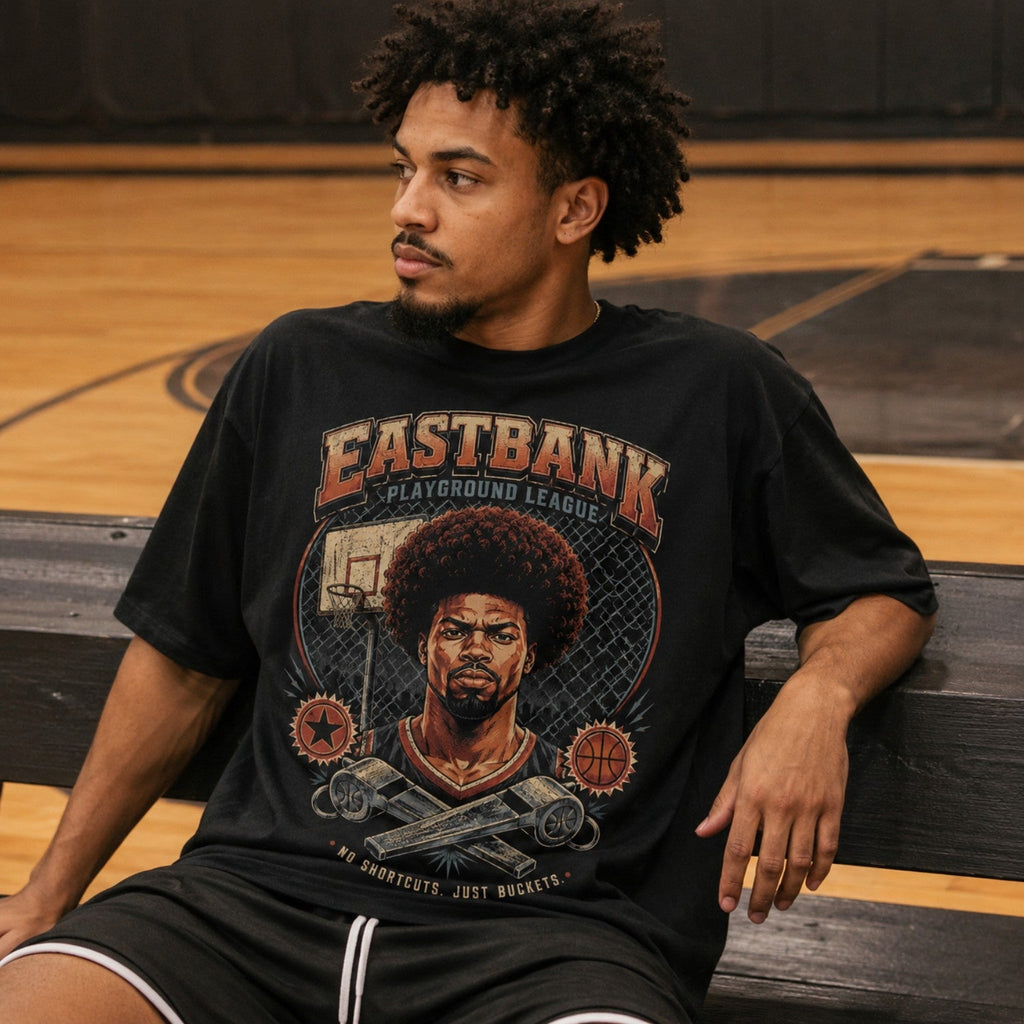 Vintage 90’s East Bank Tee worn courtside on indoor basketball bench