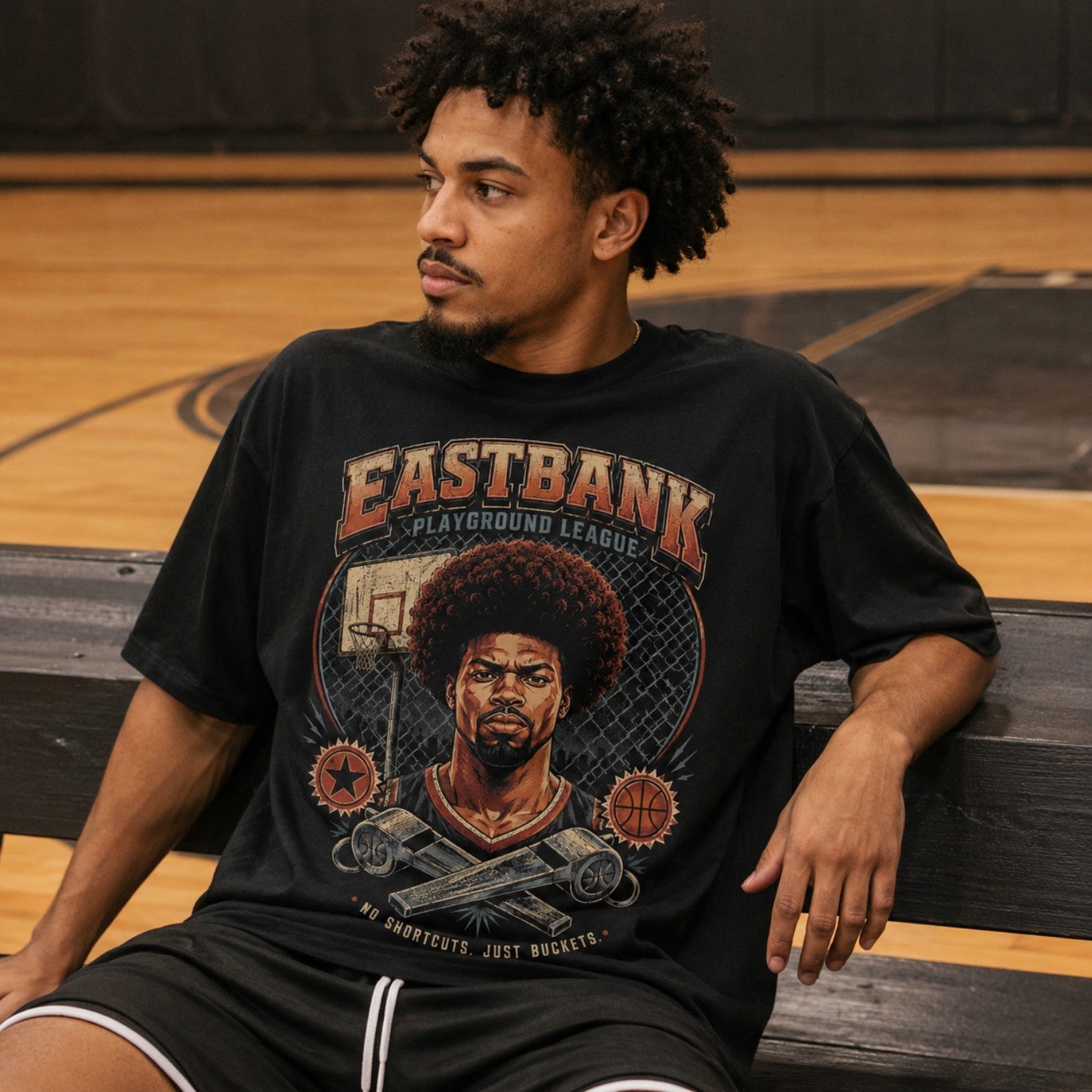 Vintage 90’s East Bank Tee worn courtside on indoor basketball bench