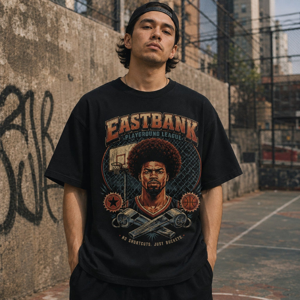 Model wearing Vintage 90’s East Bank Tee in urban basketball court setting